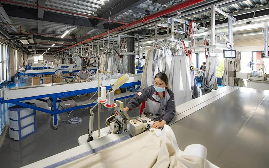 Workers In A Furniture Textile Factory Are Making Quilts Workers In A Furniture Textile Factory Are Making Quilts